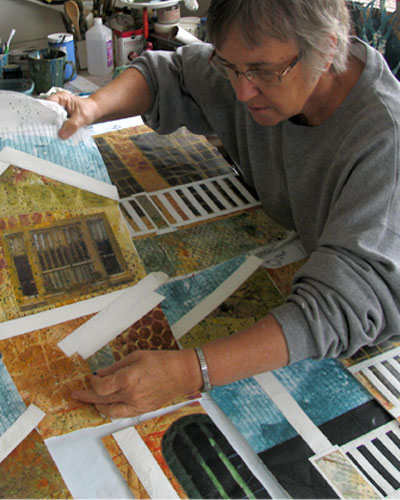 Artist Bobbi Baugh at work in the Studio assembling a Collage. See her portfolio by visiting www.ArtsyShark.com
