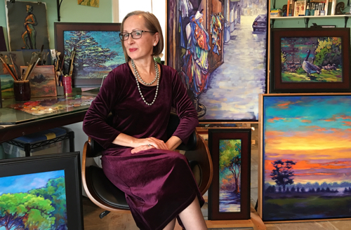 Artist Leanne Fink in her studio. See her portfolio by visiting www.ArtsyShark.com