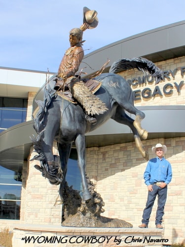 Artist Chris Navarro with “Wyoming Cowboy” Bronze Sculpture, 11’ x 16’ by artist Chris Navarro. See his portfolio by visiting www.ArtsyShark.com