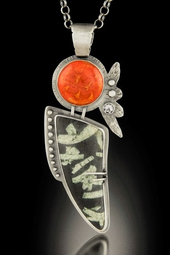 “Pele Rising” Red Sponge Coral, Chinese Writing Stone, White Topaz stone and Sterling Silver, 1.5” x 3.5” x .5” by artist Dawn Middleton. See her portfolio by visiting www.ArtsyShark.com