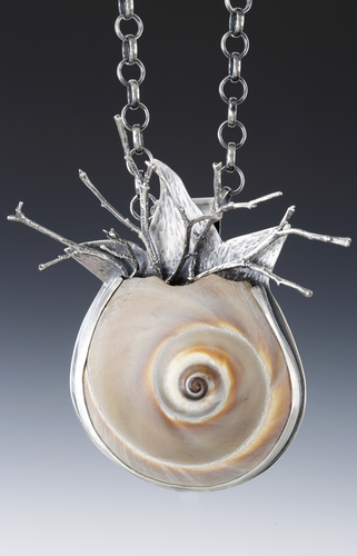 “Shark Eye Growing Coral” Shark Eye Shell with Cast Sterling Silver, 2" x 2.5" x .5" by artist Dawn Middleton. See her portfolio by visiting www.ArtsyShark.com
