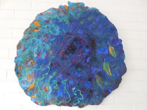 "Sky and Water" Fiber Art, 25" Diameter by artist Sylvia Brestel. See her portfolio by visiting www.ArtsyShark.com