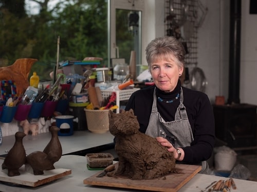 Artist Gilly Thomas in her studio. See her portfolio by visiting www.ArtsyShark.com