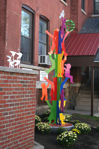 “Peace Garden Totem” (Thea Bowman House, Utica, NY) Painted Aluminum, 3’7” x 3’10” x 12’1” by artist Peter Michel. See his portfolio by visiting www.ArtsyShark.com 