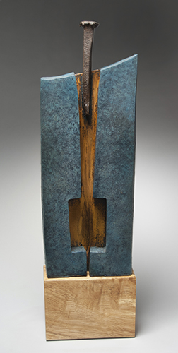 "Diversion" Steel, Old Splitting Wedge and Ceramic Sculpture, 6.5" x 19.5" x 3" by artist Joseph Boddy. See his portfolio by visiting www.ArtsyShark.com