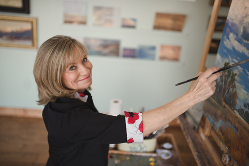 Artist Mary Garrish in her studio. See her portfolio by visiting www.ArtsyShark.com