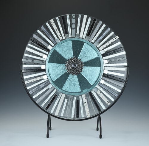 “Radiate” Kiln-Formed Glass and Industrial Parts, 15” x 15” by artist Alice Shepherd. See her portfolio by visiting www.ArtsyShark.com