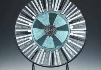 “Radiate” Kiln-Formed Glass and Industrial Parts, 15” x 15” by artist Alice Shepherd. See her portfolio by visiting www.ArtsyShark.com