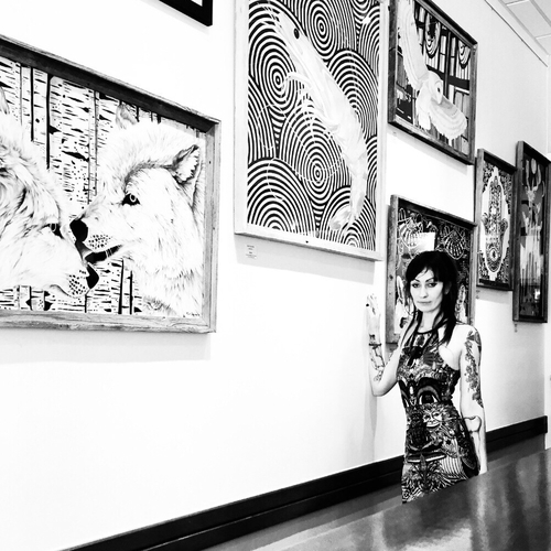 Artist Flip Solomon with her artwork. See her portfolio by visiting www.ArtsyShark.com