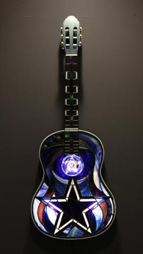 "Cowboy Guitar" Stained Glass and Copper Foil, 15" x 40" by artist Mark McCall. See his portfolio by visiting www.ArtsyShark.com