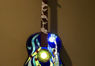 “Frog Guitar” Stained Glass and Copper Foil, 15" x 39" by artist Mark McCall. See his portfolio by visiting www.ArtsyShark.com