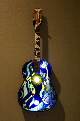 “Frog Guitar” Stained Glass and Copper Foil, 15" x 39" by artist Mark McCall. See his portfolio by visiting www.ArtsyShark.com