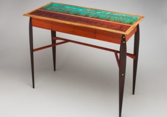 “Fire Below” Writing Desk with Wenge Legs, Paduak Stretchers and Body and Zebrawood Trim with Patinated Copper Inlay, 16” x 40” x 29” by artist Peter Judge. See his portfolio by visiting www.ArtsyShark.com