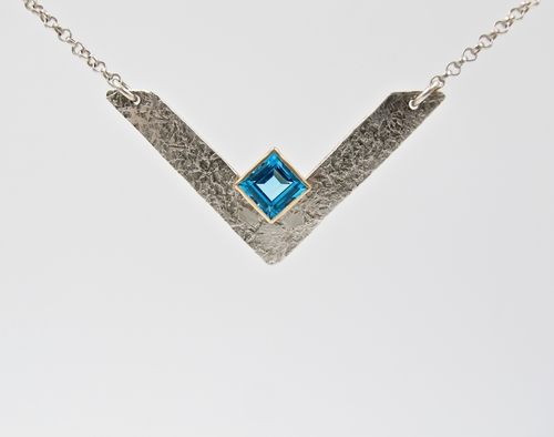 V Necklace: Sterling Silver, 14k Gold Bezel Set with 6x6mm Step Cut Swiss Blue Topaz by artist Gail Golden. See her portfolio by visiting www.ArtsyShark.com