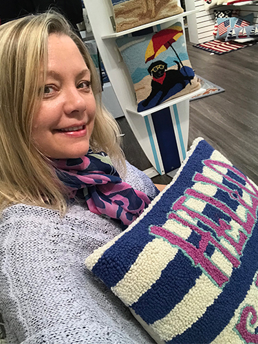 Artist Kristi Caterson shows products featuring her designs at the Americasmart trade show.