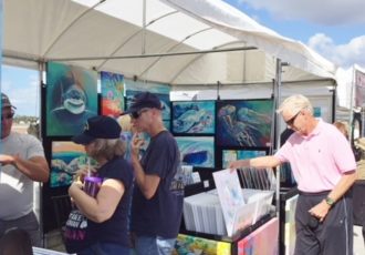Shopping at an art festival. Tips for artists are at www.ArtsyShark.com