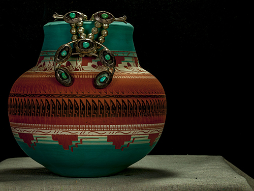 "Squash Blossom Necklace on Native American Pot" Photography, Various Sizes by Artist J. Scott Bush. See this artist's portfolio by visiting www.ArtsyShark.com
