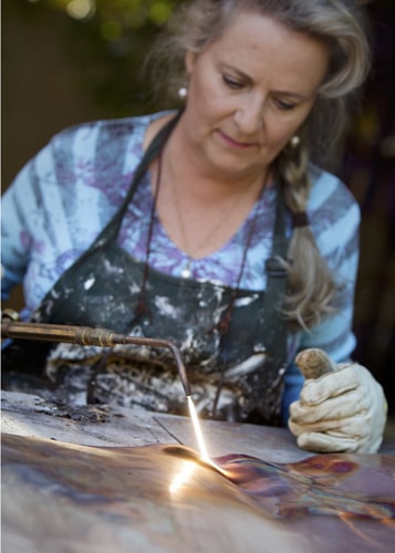 Artist Cecilia H. Calderon working with the oxy-acethylene torch. See her portfolio by visiting www.ArtsyShark.com