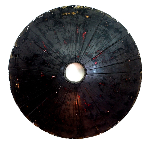 “Wheel-Like Object (Black)” Marble Dust Plaster/Cement Mixture, Acrylic, Enamel and Waxes on Wood Panel, 48” Diameter x 5” Deep by artist Curtis Olson. See his portfolio by visiting www.ArtsyShark.com