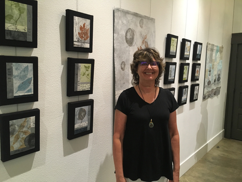 Artist Regina Dunn at her solo exhibit of “Transformations”