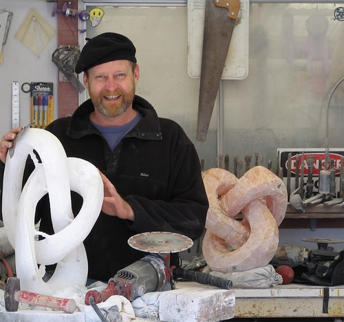 Artist T Barny with "DAUPHI"N in Process, Italian Alabaster, 16" x 22" x 12"