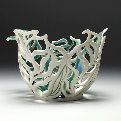 Hand built and pierced porcelain bowl by Vivian Saich