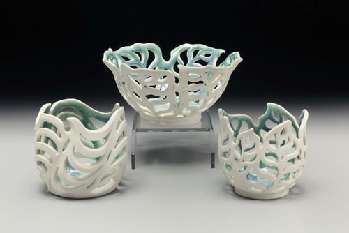 Hand built and pierced porcelain bowl and two orchid pots by Vivian Saich