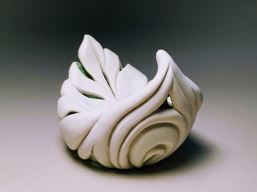 Hand built porcelain leaf vessel by Vivian Saich