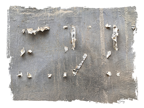 “Bits N Pieces” (Nawalgarh, India) Photograph of gray wall with remnants of posters by Denise Solay