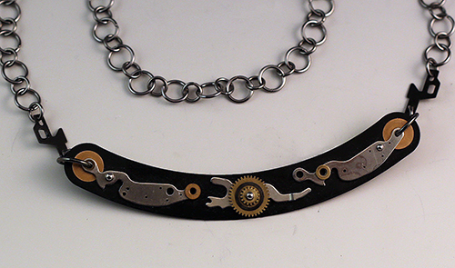 Jewelry necklace made with camera parts by Sharon Deveaux