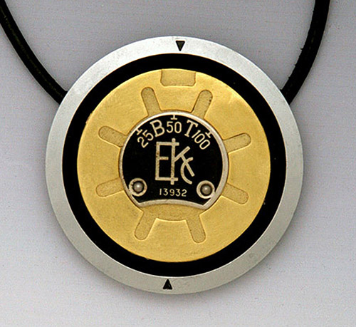 Jewelry pendant made with camera parts by Sharon Deveaux
