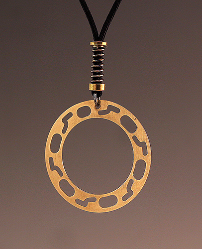 Jewelry pendant made with camera parts by Sharon Deveaux