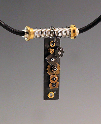 Jewelry pendant made with camera parts by Sharon Deveaux