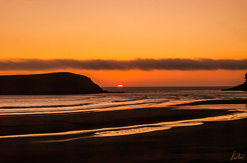 Dramatic orange sunset photograph by Tom Kostes