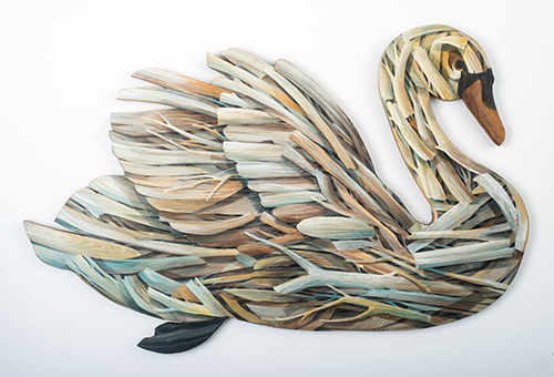 Swan by artist Johnny Karwan made from wood painted with a pattern of branches.
