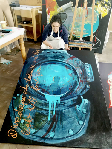 Artist Tatjana Lee in her studio at work on "Deepsea Diver"
