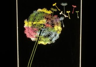 LED lamp of a dandelion puff etched on lucite by Jean-Luc Godard