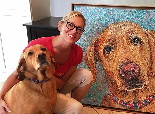 Artist Gretchen Serrano (KISH) with the dog Neptune and his drip paint portrait