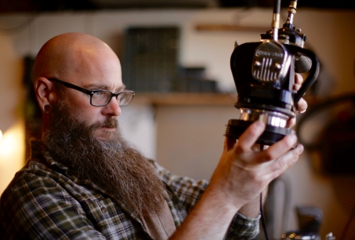 Artist Jason Lyons with one of his found objects