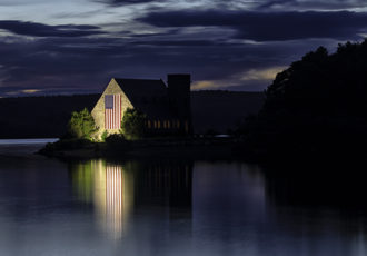 Photograph of sunset over the Old Stone Church at the Wachusett Reservoir in West Boyleston, Massachusetts by Cheryl Harris