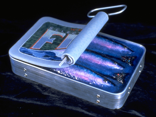 Glass sculpture of a tin of sardines partially opened by Michael Dupille
