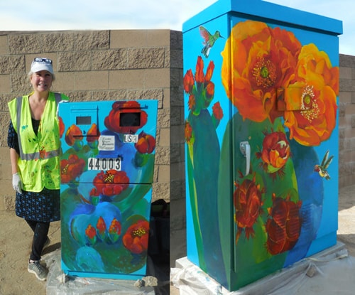 Artist Diane Morgan next to one of the signal boxes she painted for the City of Palm Desert, California
