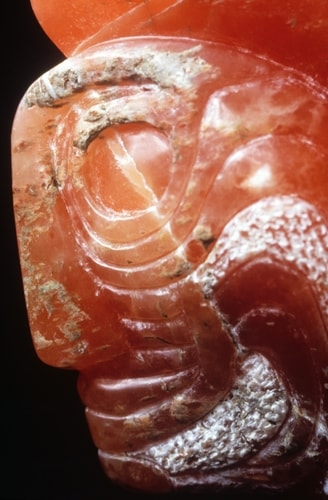 Detail of a stone sculpture of a shaman's face by Darcy Meeker