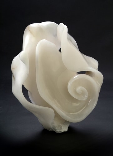 Stone sculpture of an abstract spiral by Darcy Meeker