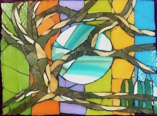 Abstract glass mosaic of the moon behind tree branches by Carol Davis