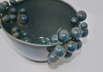 Ceramic bowl with orbs by Daniela Kouzov
