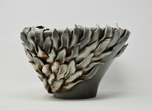 Hand thrown contemporary vase with hand cut leaves by Daniela Kouzov