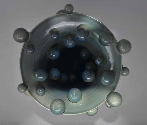 Contemporary ceramic vase with attached orbs by Daniela Kouzov