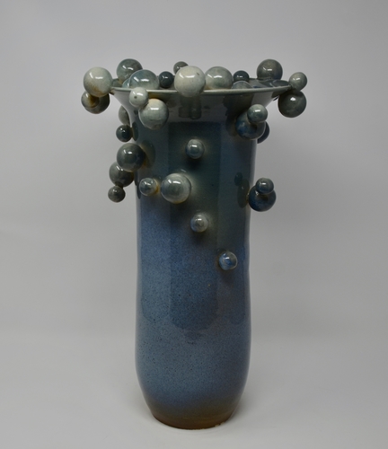 Contemporary ceramic vase with attached orbs by Daniela Kouzov