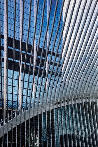 Mixed media quilted fiber art of the Oculus building in NYC by Marilyn Henrion
